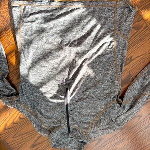 Large oversized athletic quarter zip with thin holes and back pocket